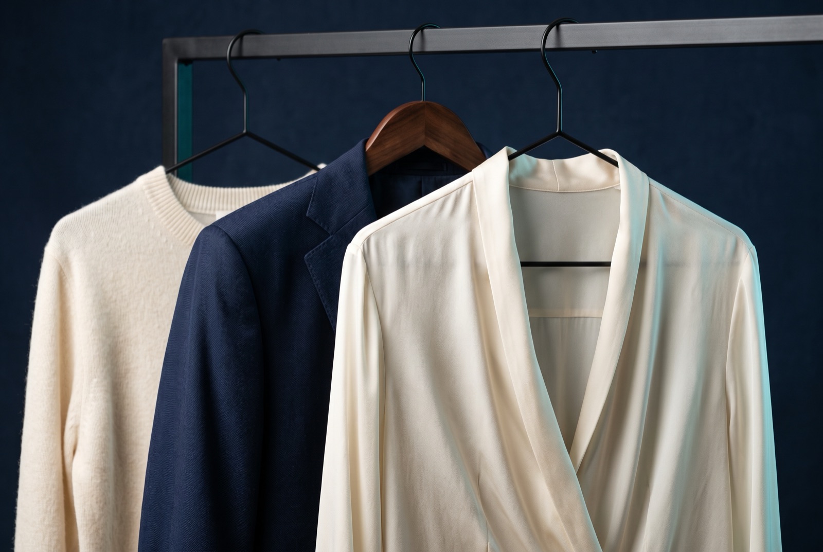 Freshly cleaned garments hanging on a rail at The Garment Studio in Decatur